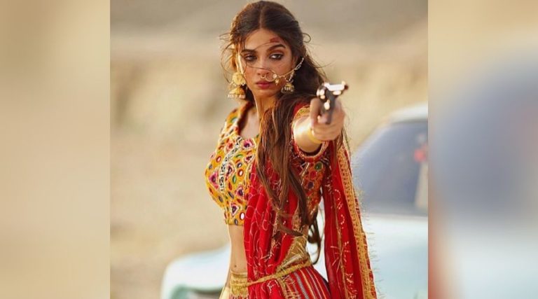 Nabeel Qureshi’s teaser video of ‘Ki Jana’ features Sonya Hussyn in Red Sari with a Gun in hand